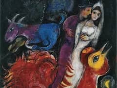 The Bride and Groom on Cock by Marc Chagall